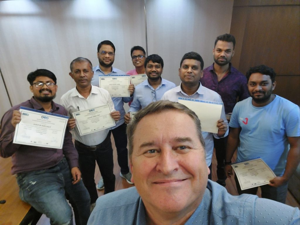 A group photo of our students with their certificates in Bangladesh.
